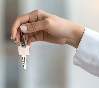 Person Giving Keys to A house to Someone Else